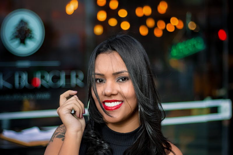 Head chef Marco stretching pizza dough in the kitchen
